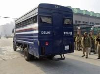 a-police-van-carrying-five-men-accused-of-the-gang-rape-and-murder-of-an-indian-student-arrives-at-a-court-in-new-delhi-january-7-2013