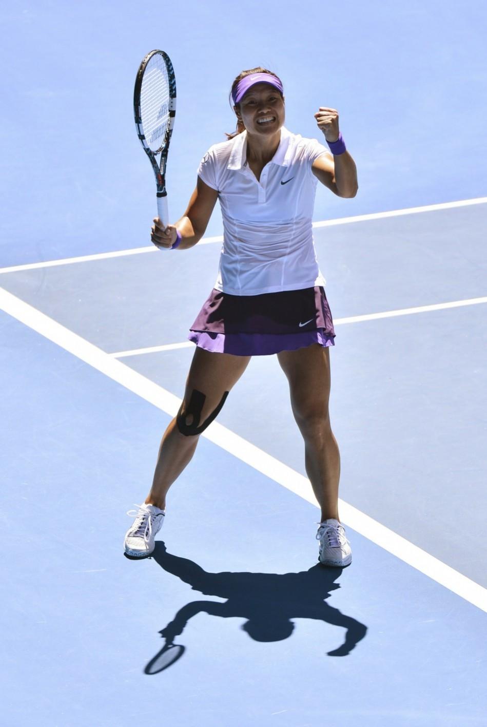 Li Na of China celebrates defeating Maria Sharapova of Russia in their women's singles semi-final match at the Australian Open tennis tournament in Melbourne Li Na