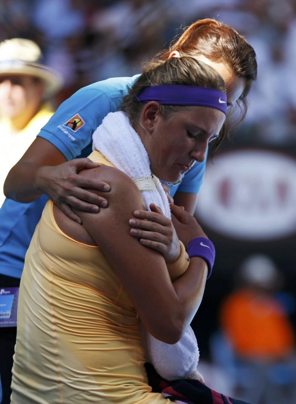 Victoria Azarenka of Belarus receives medical treatment during a break in her women's singles semi-final match against Sloane Stephens of the U.S. at the Australian Open tennis tournament in Melbourne Victoria Azarenka