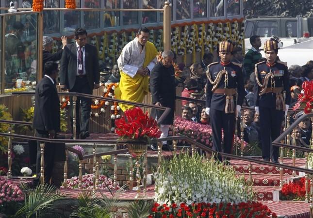 Bhutan's King Wangchuck and India's President Mukherjee leave after attending the Republic Day parade in New Delhi (Reuters)