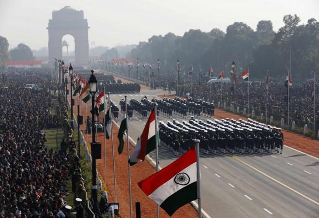 People watch Indian soldiers march during the Republic Day parade in New Delhi (Reuters)