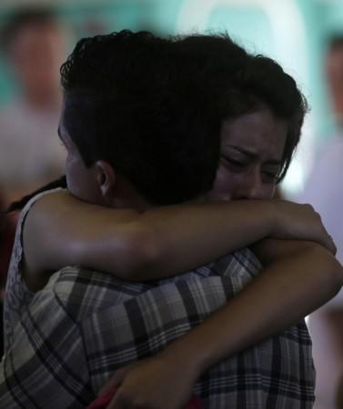 Relatives of victims of the fire at Boate Kiss nightclub react during a collective wake in Santa Maria Relatives of victims of the fire at Boate Kiss nightclub react during a collective wake in Santa Maria