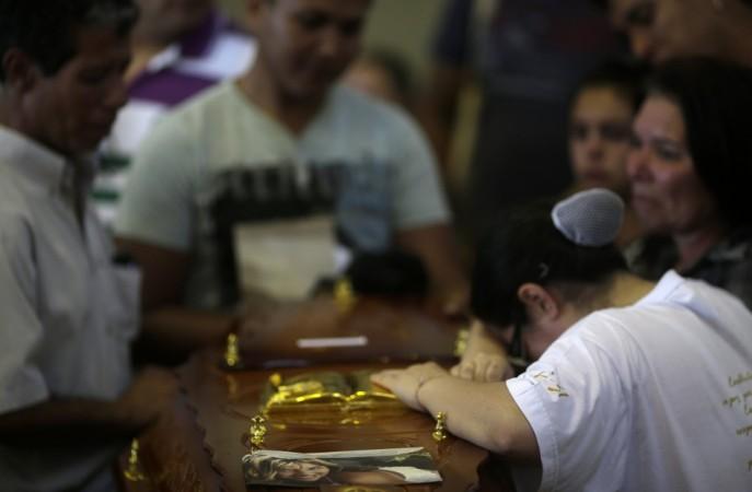 Relatives of Shaiana Antoline mourn over her coffin during a collective wake for victims of the fire at Boate Kiss nightclub in Santa Maria Relatives of Shaiana Antoline mourn over her coffin during a collective wake for victims of the fire at Boate Kiss nightclub in Santa Maria