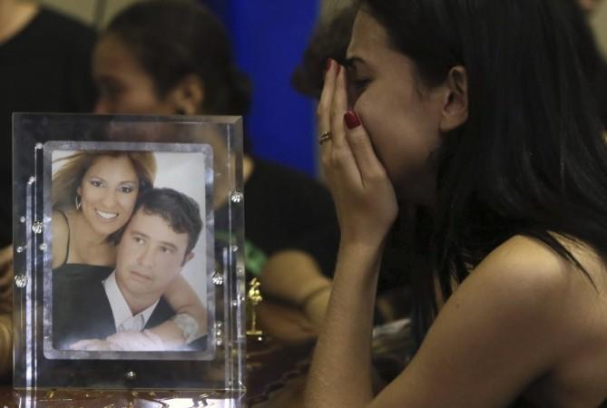 A relative of victims of the fire at Boate Kiss nightclub attends a collective wake in the southern city of Santa Maria A relative of victims of the fire at Boate Kiss nightclub attends a collective wake in the southern city of Santa Maria