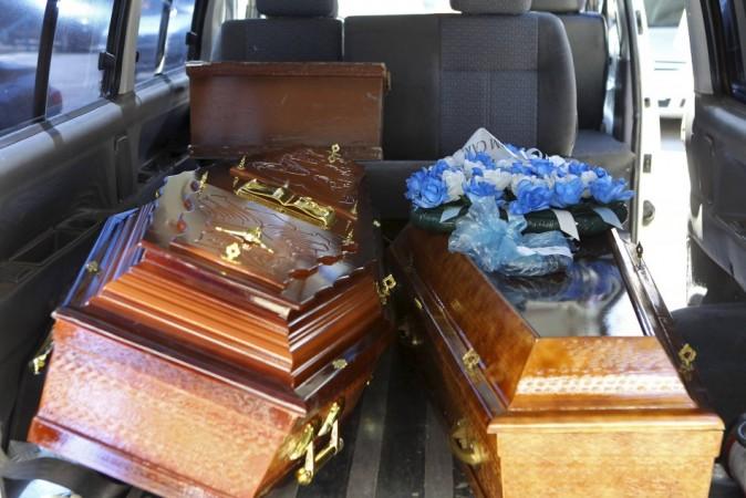 Coffins containing the bodies of victims from fire at Boate Kiss nightclub are seen inside a funeral home vehicle in the southern city of Santa Maria Coffins containing the bodies of victims from fire at Boate Kiss nightclub are seen inside a funeral home vehicle in the southern city of Santa Maria