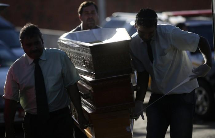 Funeral home workers arrive with empty coffins for victims of the fire at Boate Kiss nightclub before a collective wake in Santa Maria Funeral home workers arrive with empty coffins for victims of the fire at Boate Kiss nightclub before a collective wake in Santa Maria