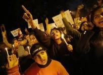 demonstrators-shout-slogans-and-raise-their-hands-during-a-candlelight-march-for-a-gang-rape-victim-who-was-assaulted-in-new-delhi-january-16-2013
