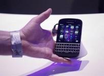 an-attendee-reaches-out-to-grab-a-newly-launched-research-in-motion-rim-blackberry-10-device-in-new-york-january-30-2013