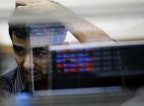 a-broker-reacts-while-trading-at-a-stock-brokerage-firm-in-mumbai-november-11-2008
