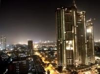 mumbai-topped-the-list-of-worlds-cheapest-cities-of-2013-a-high-rise-building-is-lit-up-during-construction-in-mumbai-december-22-2006-reuters