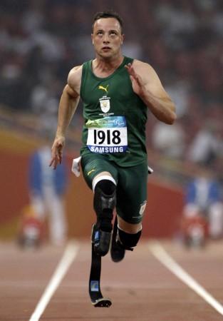 File photo of South Africa's Oscar Pistorius running. He is reportedly dating a teen student ahead of his trial on march 3.