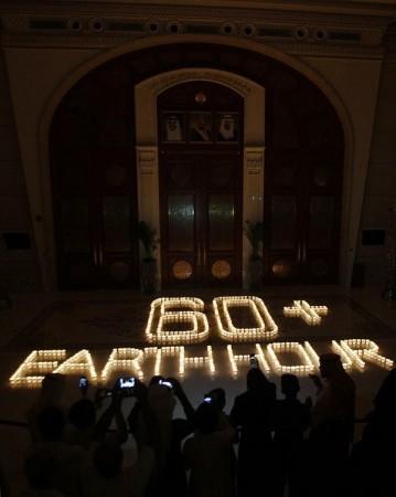 Saudis light candles to mark Earth Hour at the Ritz Carlton in Riyadh