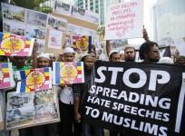 myanmar-muslims-living-in-malaysia-show-banners-and-placards-during-a-demonstration-against-the-killings-of-muslims