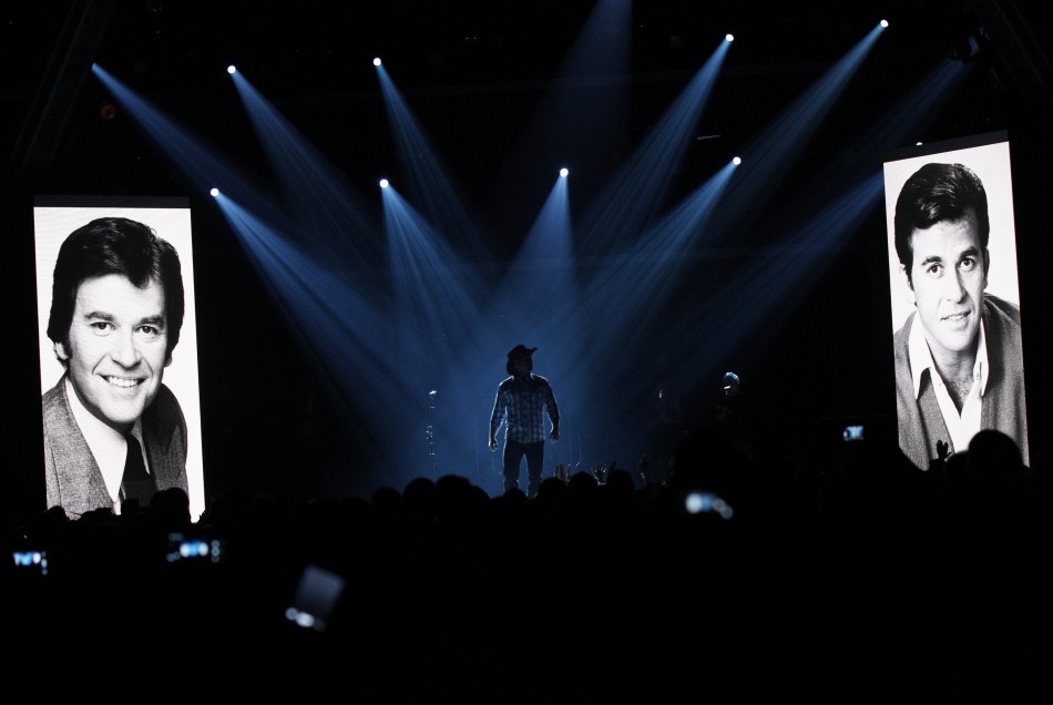 Garth Brooks takes the stage to sing Garth Brooks takes the stage to sing