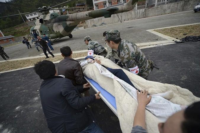 Rescuers rush to carry a victim onto a helicopter after a strong 6.6 magnitude earthquake hit Taiping town of Lushan county, Sichuan province April 20, 2013. (Reuters) Rescuers rush to carry a victim onto a helicopter after a strong 6.6 magnitude earthquake hit Taiping town of Lushan county, Sichuan province April 20, 2013. (Reuters)