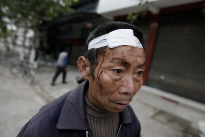 A 61-year-old survivor Wang Mingkai walks on a road after a strong 6.6 magnitude earthquake hit a village in Lushan county of Ya'an, Sichuan province April 21, 2013. (Reuters) A 61-year-old survivor Wang Mingkai walks on a road after a strong 6.6 magnitude earthquake hit a village in Lushan county of Ya'an, Sichuan province April 21, 2013. (Reuters)