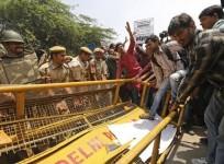 demonstrators-try-to-cross-a-police-barricade-during-a-protest-outside-police-headquarters-in-new-delhi-april-20-2013-hundreds-of-angry-protesters-gathered-outside-the-headquarters-of-delhi-police-on-saturday-after-a-five-year-old-girl-was-allegedly-rap