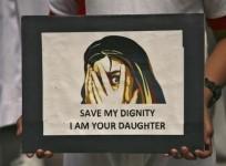 a-placard-denouncing-the-high-rate-of-rape-cases-in-india