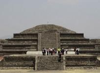 visitors-look-on-at-the-archaeological-area-of-the-quetzalcoatl-temple-near-the-pyramid-of-the-sun