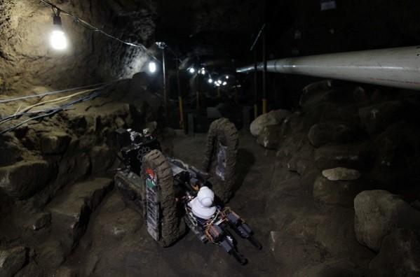 A worker from the National Institute of Anthropology and History walks next to a robot used to explore ruins on the entrance of a tunnel in the archaeological area of the Quetzalcoatl Temple near the Pyramid of the Sun at the Teotihuacan archaeological site (Credit: Reuters) A worker from the National Institute of Anthropology and History walks next to a robot used to explore ruins on the entrance of a tunnel
