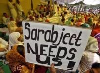 a-demonstrator-holds-a-placard-during-a-hunger-strike-by-sarabjit-singh039s-family-members-demanding-singh039s-release-from-a-pakistani-prison-in-new-delhi-may-17-2011