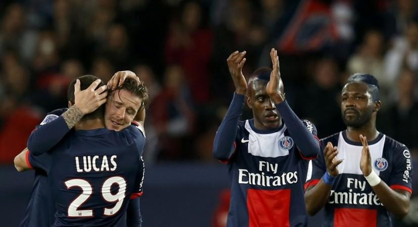 Paris Saint-Germain's Beckham hugs team mates at the end of his team's French Ligue 1 soccer match against Brest at the Parc des Princes stadium in Paris David Beckham