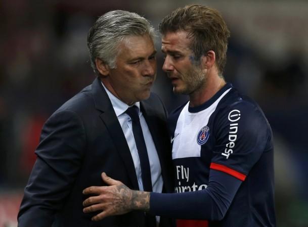 Paris Saint-Germain's Beckham hugs coach Ancelotti at the end of his team's French Ligue 1 soccer match against Brest at the Parc des Princes stadium in Paris David Beckham