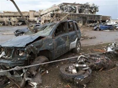 A destroyed motorcycle lies next to a crushed vehicle after a huge tornado struck Moore, Oklahoma, near Oklahoma City, May 20, 2013. (REUTERS/Richard Rowe) A destroyed motorcycle lies next to a crushed vehicle after a huge tornado struck Moore, Oklahoma, near Oklahoma City, May 20, 2013. (REUTERS/Richard Rowe)