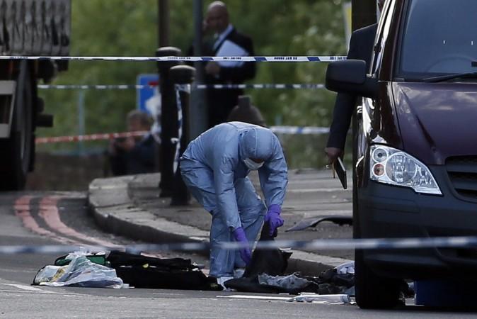 A police forensics officer investigates a crime scene where one man was killed in Woolwich, southeast London(Reuters) A representational picture for crime