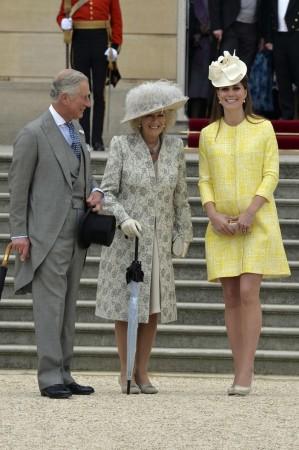 Britain's Catherine, Duchess of Cambridge poses with Camilla, Duchess of Cornwall and Prince Charles during a garden party at Buckingham Palace in London Duchess of Cambridge