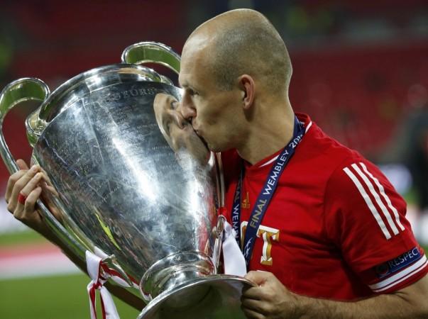 Bayern Munich's Robben kisses the trophy after defeating Borussia Dortmund in their Champions League Final soccer match at Wembley Stadium in London Arjen Robben