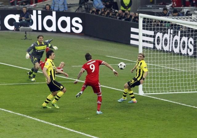 Bayern Munich's Mario Mandzukic shoots to score past Borussia Dortmund's Marcel Schmelzer during their Champions League Final soccer match at Wembley Stadium in London Bayern Munich, Mario Mandzukic