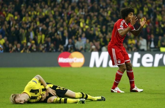 Bayern Munich's Dante reacts after fouling Borussia Dortmund's Marco Reus during the Champions League Final soccer match at Wembley Stadium in London Bayern Munich