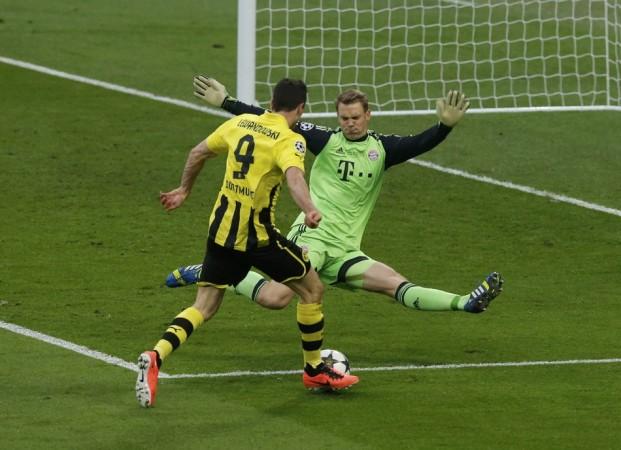 Bayern Munich's goalkeeper Manuel Neuer saves a shot from Borussia Dortmund's Robert Lewandowski during their Champions League Final soccer match at Wembley Stadium in London Bayern Munich, Manuel Neuer
