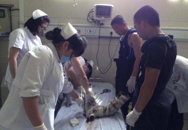 Firefighters and doctors rescue an abandoned newborn baby boy by cutting away a sewage pipe piece by piece, in this still image taken from video, in Jinhua city, Zhejiang province May 25, 2013 (Reuters) Chinese Newborn baby