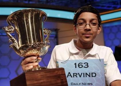 Arvind Mahankali of New York holds his trophy after winning the National Spelling Bee Contest.