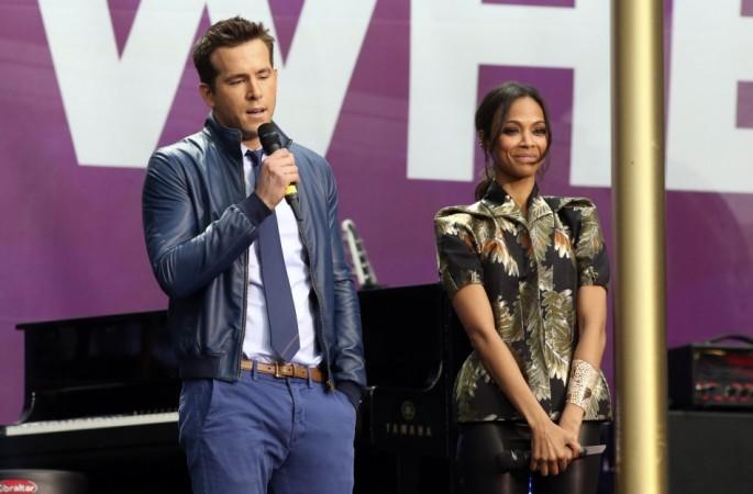 Ryan Reynolds and Zoe Saldana speak at the Sound of Change concert at Twickenham Stadium in London June 1, 2013. REUTERS Ryan Reynolds and Zoe Saldana
