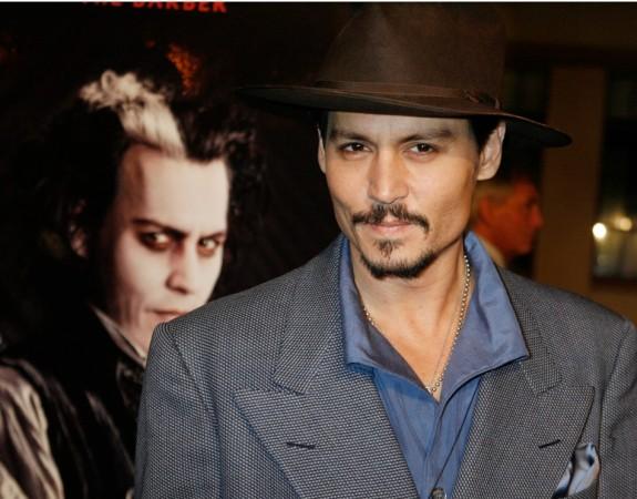 Johnny Depp Johnny Depp poses next to a poster featuring him in character at a special screening of the DreamWorks Pictures film