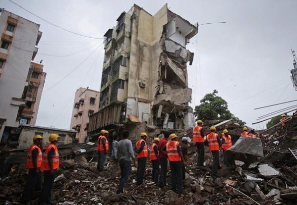 Rescue workers search through rubble at the site of a collapsed residential building in Mumbai (Reuters) Mumbai building collapse