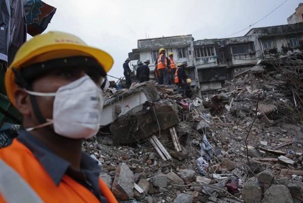 Rescue workers search through rubble (Reuters) Mumbai building collapse