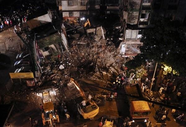 Excavators work to clear rubble at the site of a collapsed residential building in Mumbai. (Reuters) Mumbai building collapse