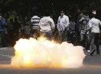 a-tear-gas-shell-fired-by-riot-police-explodes-near-pro-telengana-supporters-during-a-demonstration-in-hyderabad-march-10-2011-reuters-krishnendu-halder