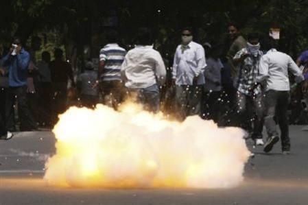 A tear gas shell fired by riot police explodes near pro-Telengana supporters during a demonstration in Hyderabad March 10, 2011(Reuters/Krishnendu Halder) A tear gas shell fired by riot police explodes near pro-Telengana supporters during a demonstration in Hyderabad March 10, 2011(Reuters/Krishnendu Halder)