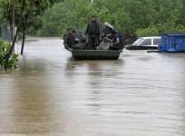 indian-army-soldiers-rescue-stranded-villagers-in-a-boat-after-floods-triggered-by-heavy-rains-reuters