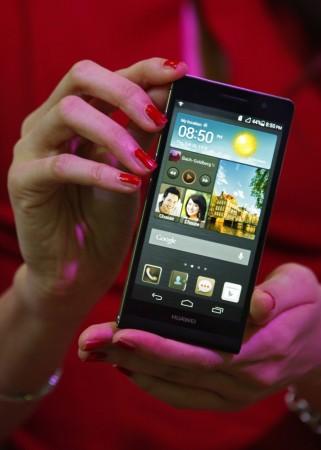 A model presents the Huawei Ascend P6 Android-based smartphone during their launch at the CommunicAsia communication and information technology exhibition in Singapore Huawei Ascend P6