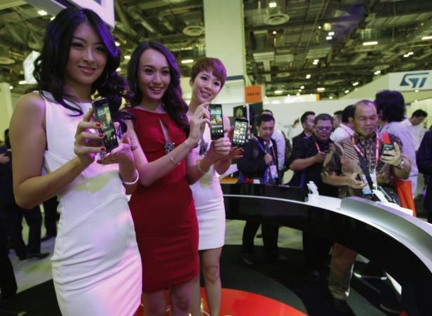 Models present the Huawei Ascend P6 Android-based smartphone during their launch at the CommunicAsia communication and information technology exhibition in Singapore Huawei Ascend P6