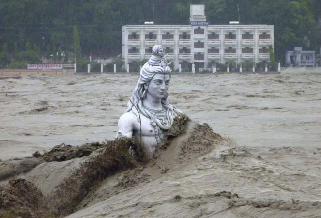 A submerged statue of the Hindu Lord Shiva stands amid the flooded waters of river Ganges at Rishikesh in the Himalayan state of Uttarakhand. (Reuters) North India Flood