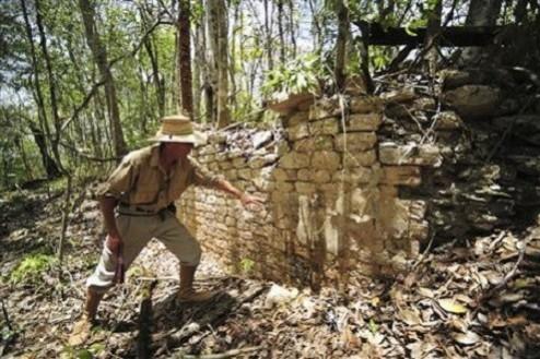 A National Institute of Anthropology and History (INAH) worker shows the remains of a building at the newly discovered ancient Maya city Chactun in Yucatan peninsula. (REUTERS/INAH/Handout via Reuters) Remains of a building at the newly discovered ancient Maya city Chactun