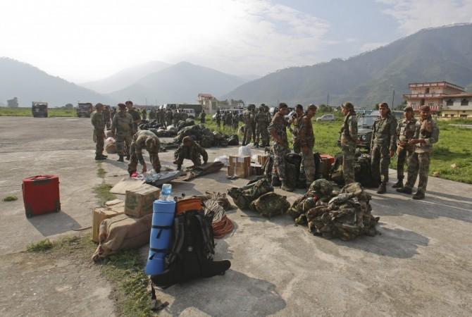Indian Army Paratroopers prepare to leave for rescue operations at an airfield in Gauchar in the Himalayan state of Uttarakhand June 20, 2013. (Reuters) North India Floods