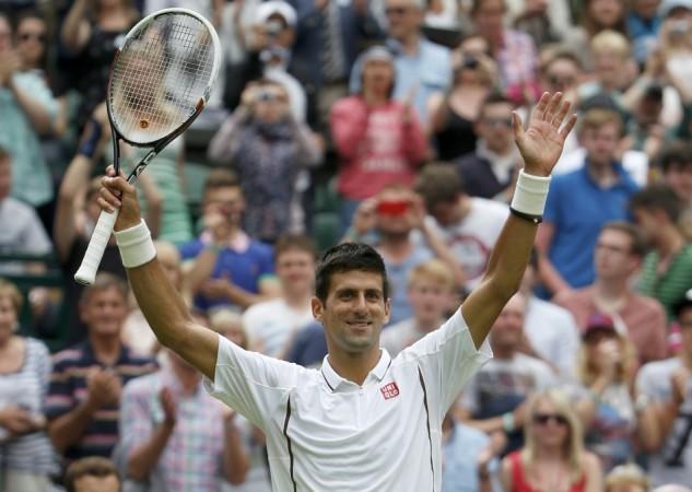 Novak Djokovic of Serbia celebrates after defeating Florian Mayer of Germany in their men's singles tennis match at the Wimbledon Tennis Championships, in London Novak Djokovic